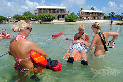 Campers practicing shallow water lifeguarding techniques at Seacamp