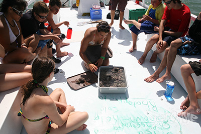 Instructor giving a lesson aboard a Seacamp flattop