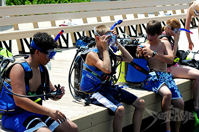 Campers preparing gear before a dive at Seacamp