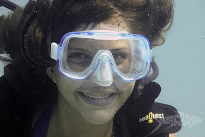 Camper smiling underwater at Seacamp